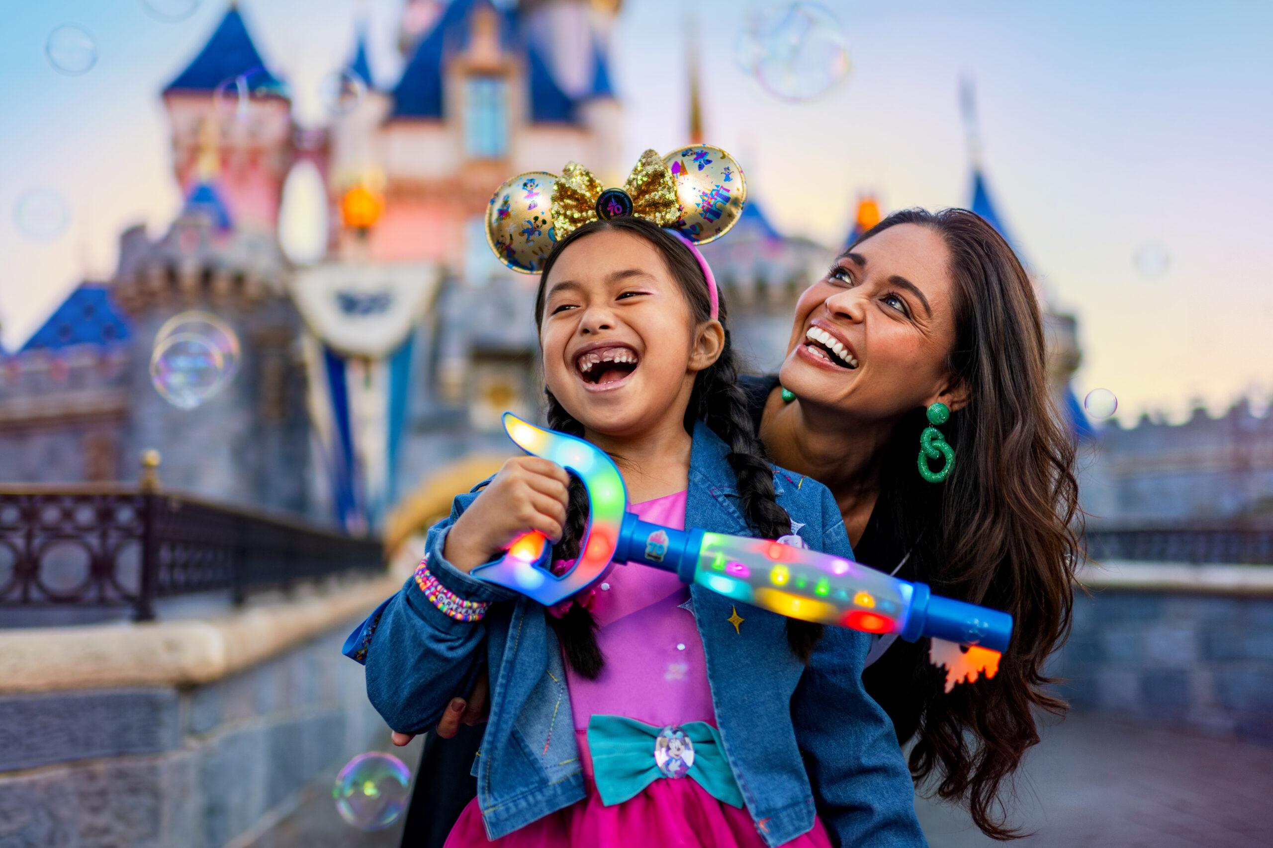 Mother and child in front of the Disneyland Castle