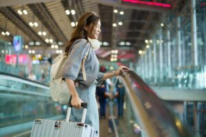 Person with luggage walking at an airport