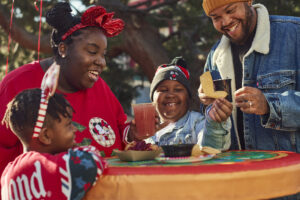 Family having lunch inside Disneyland - image